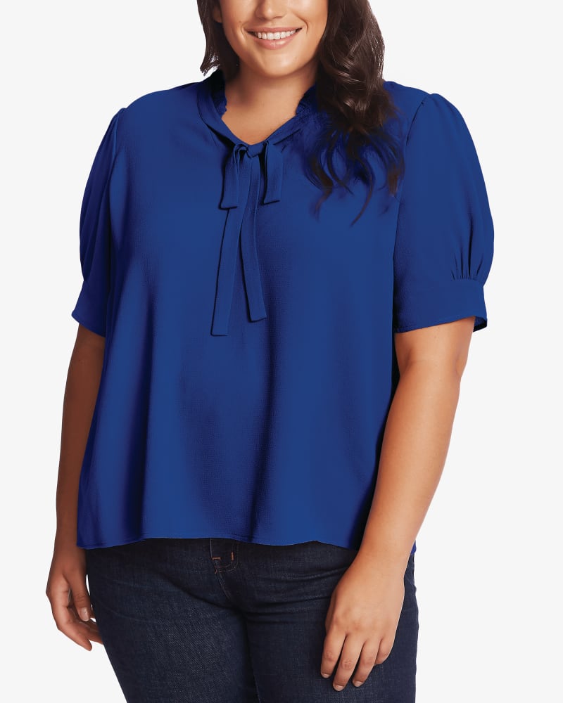 Front of a model wearing a size 1X Maeve Tie-Neck Top in 325-DP ROYAL BLU by CeCe. | dia_product_style_image_id:263761